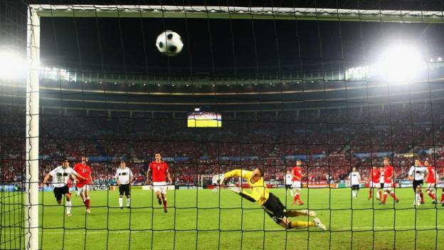 Michael Ballack scores a free kick for Germany.